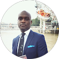 Man in suit by riverside