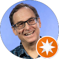 Man wearing glasses and checkered shirt