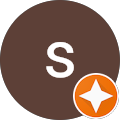 Initial 'S' with orange star badge