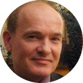 Bald man with a neutral expression
